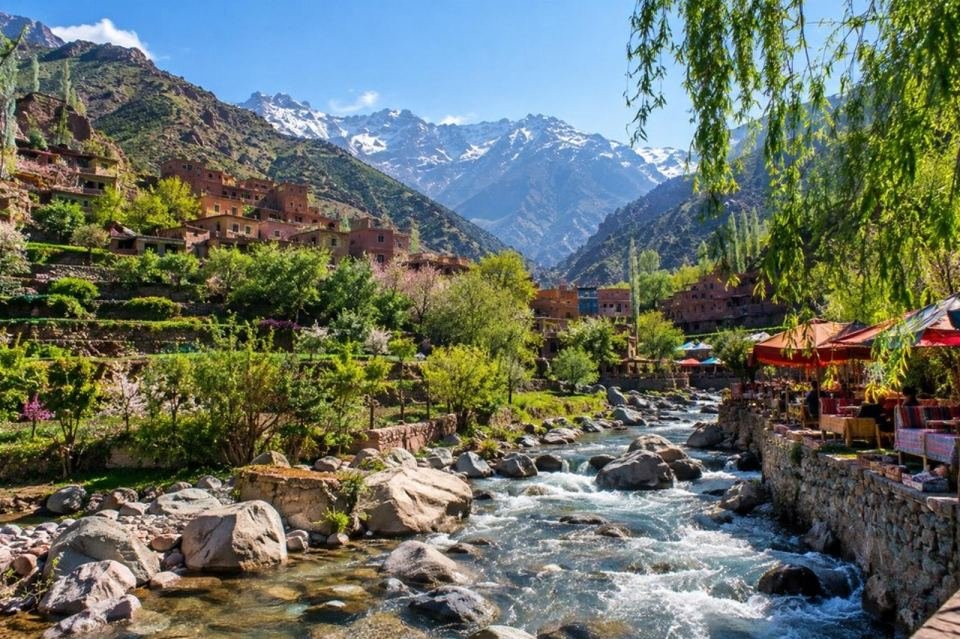 Ourika Valley river flowing through a green mountain village in Morocco's High Atlas
